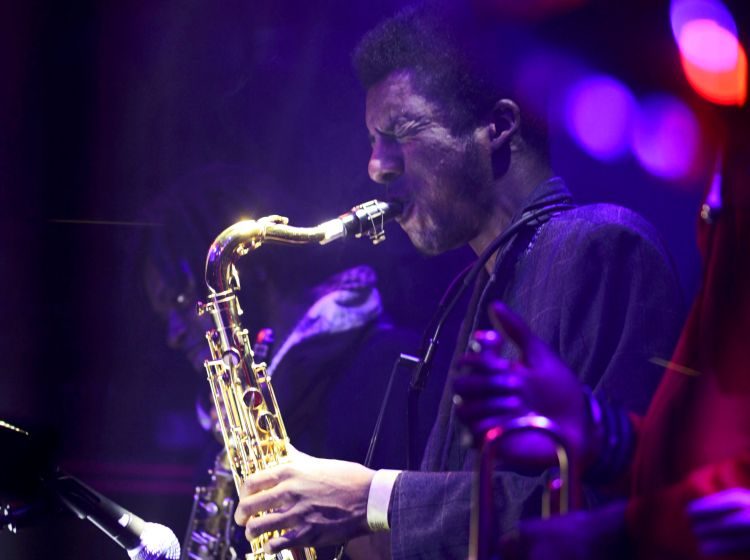 Xhosa Cole performing on his saxophone