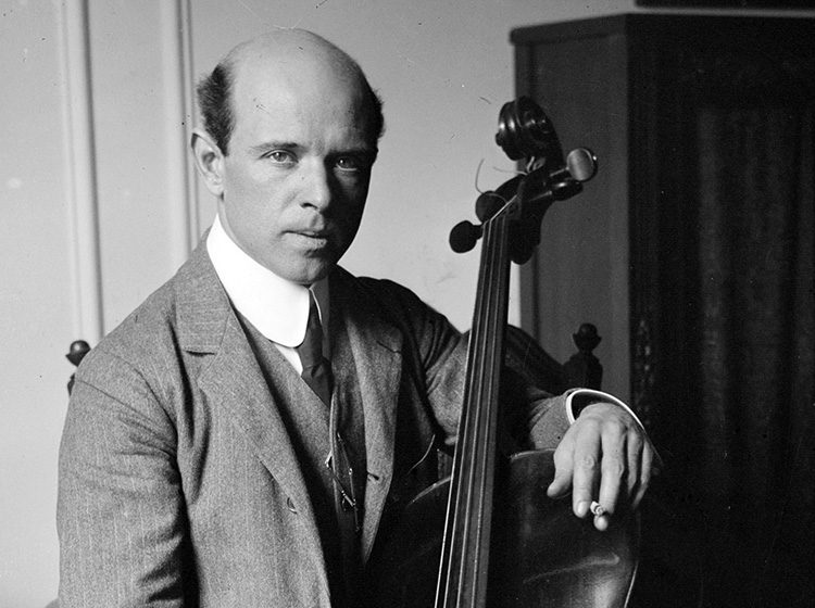 Black & white photo of Pablo Casals holding his cello