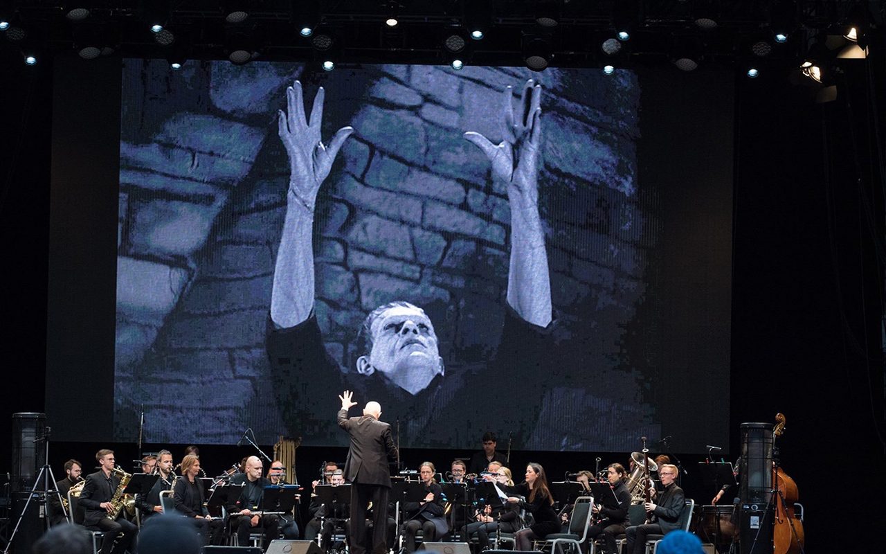 Frankenstein - still from the 1931 movie on a giant screen behind the orchestra performing the score live