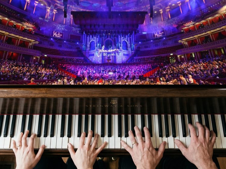 4 hand piano before John Lewis Partnership choir