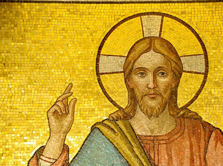 A shimmering gold mosaic of Christ
